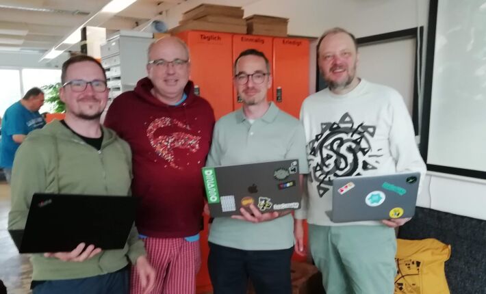 The crew of Homebrew Website Club Nuremberg 2024-06-12. 4 people with laptops standing in Fab Lab Nuremberg.