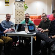 The participants of HWC Nuremberg 11/2024 sitting around a table.